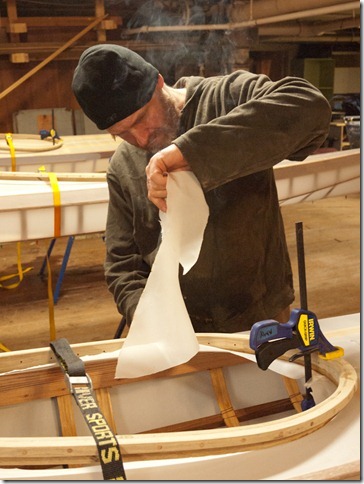 We've clamped the comings in place and Brian cut out the excess fabric with the hot knife